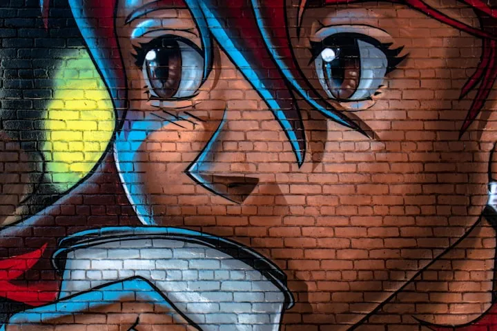 Graffiti on a red brick wall of an anime-style red-haired girl drinking from a white cup